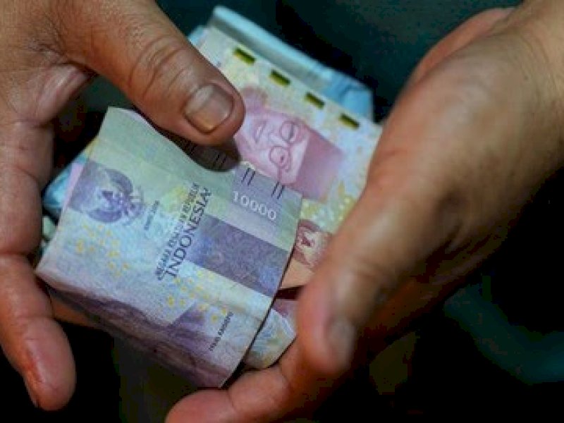 Ilustrasi uang THR. (Foto: Bloomberg via Getty Images/Bloomberg).